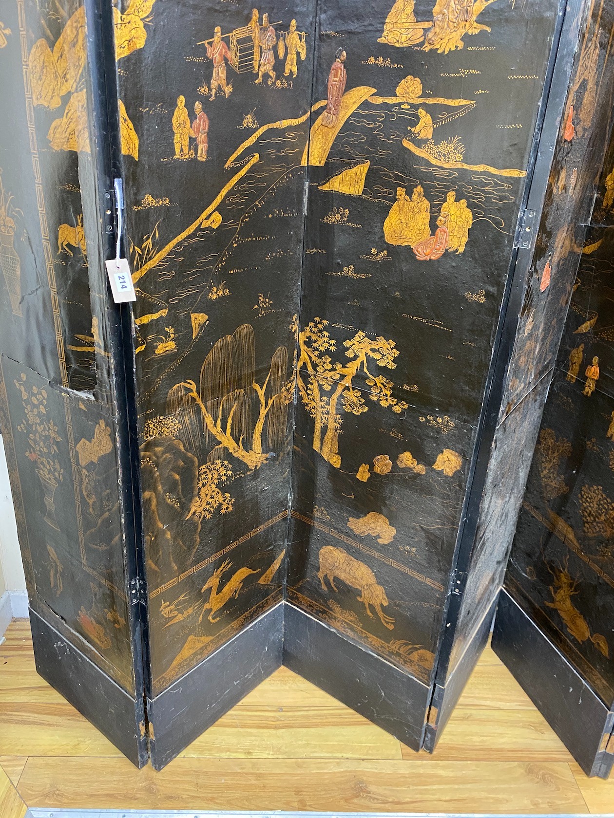 A Chinese chinoiserie lacquered six fold screen, panel width 46cm, height 237cm